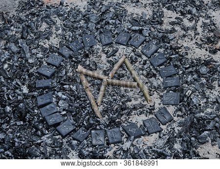 Norse Rune Mannaz On Ashes Backgorund Inside The Circle Of 24 Norse Runes
