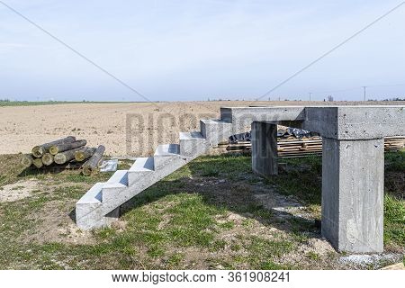 Concrete Rectangular Structure On Concrete Poles With Stairs In Raw Condition, Standing In A Field I