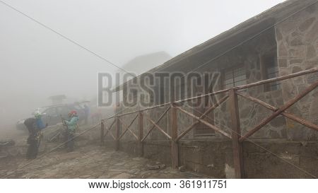 Cayambe, Pichincha / Ecuador - February 24 2020: People Dressed In Climbing Gear Standing Next To Th