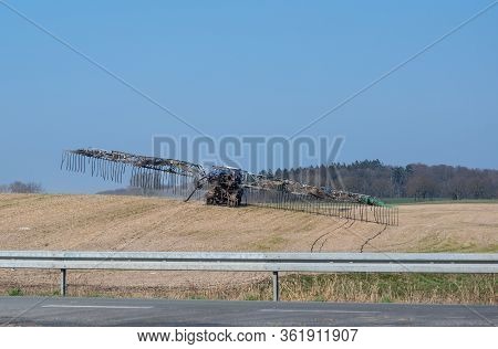 Modern Slurry Hosing, Agricultural Vehicle Is Distributing Liquid Manure Through Hoses In The Field 