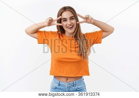 Summetime, Students And Youth Concept. Portrait Of Cheerful Blond Girl Sending Positive Vibes, Smili