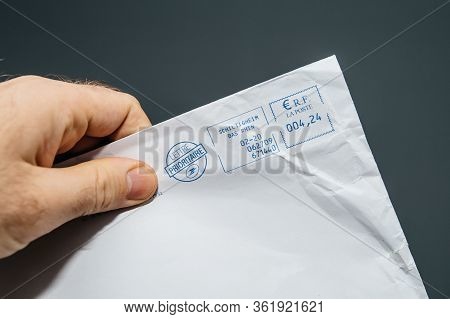 Paris, France - Feb, 25, 2020: Male Hand Holding French Paper Envelope Lettre Prioritaire Priority F