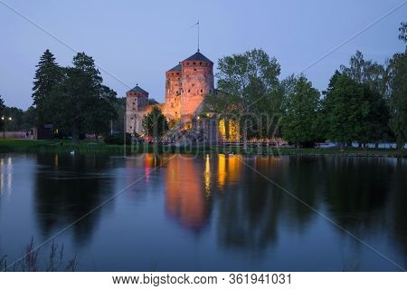 The Ancient Fortress Of The Savonlinna City On A July Twilight. Finland