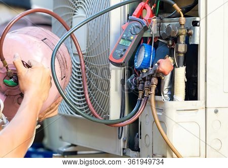 Air Conditioning Repair Man Checking And Fixing Modern Air Conditioning System, Technician Team Chec