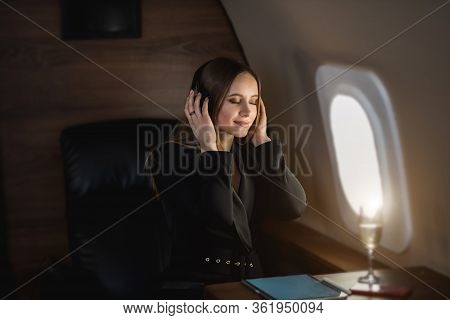 Attractive Woman In Private Jet