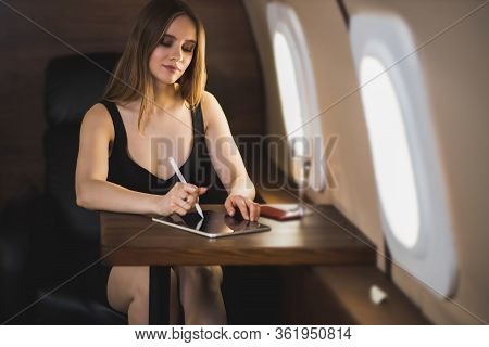Attractive Woman In Private Jet