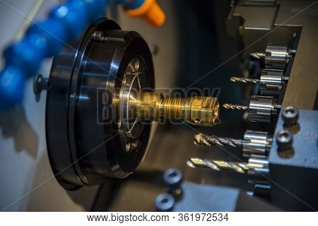 The  Multi-tasking Cnc Lathe Machine Swiss Type Tapping At The Brass  Shaft . The Hi-technology Meta