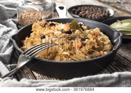 Bigos, A Traditional Polish Dish Of Sauerkraut Served In A Cast Iron Skillet.