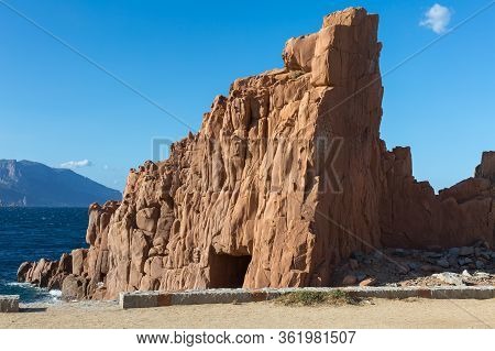 Sardinia Coastline: Typical Red Rocks And Cliffs Near Sea In Arbatax; Italy.