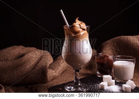 Cold Trendy Drink Korean Dalgon Iced Coffee On A Dark Background. Delicious And Popular Coffee In Th
