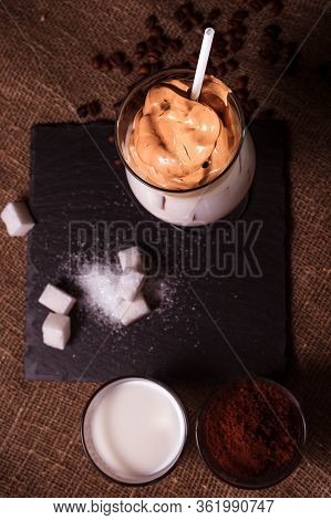 Iced Korean Dalgona Coffee, A Trendy Fluffy Creamy Whipped Coffee With White Tube And Ice. Trendy Co
