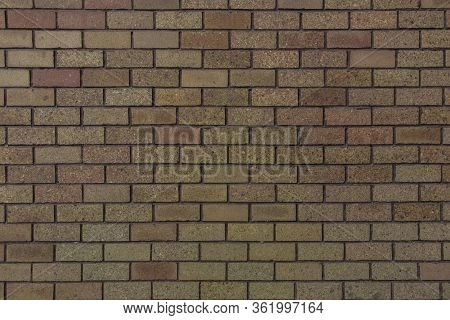 Small Bricks Red And Broen Color Arranged In Rows On The Wall, For Close Up Texture And Design Work 