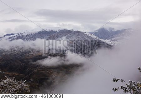 Panoramic View From The Gunib Village, Dagestan, Russia. Snow-capped Mountains And Winter Forest. Be