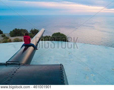 Tourist Woman On Bateria De Castillitos In Spain Cartagena, Cabo Tinoso. Military Cannon For Coastal