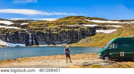Tourism Vacation And Travel. Camper Van On Camp Site At Mountain Lake Flotvatnet. National Tourist R
