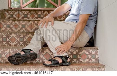 Man Hand Massage Physiotherapy Leg Is Sore And Numb, Exhausted, Tingling. Guillain-barre Syndrome, A