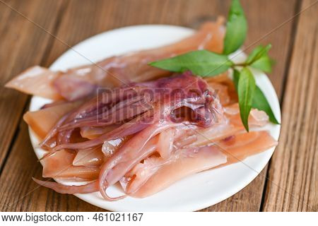 Pickled Squid On White Plate, Raw Squid For Cooking Food On Wooden Table, Preserving Food Seafood