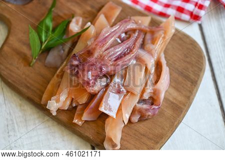 Raw Squid For Cooking Food On Wooden Cutting Board, Pickled Squid On Plate, Preserving Food Seafood 