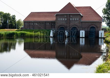 Vollenhove, Overijssel, The Netherlands, 07 20 2022 - Historical Water Gate House In Brickstones, Re