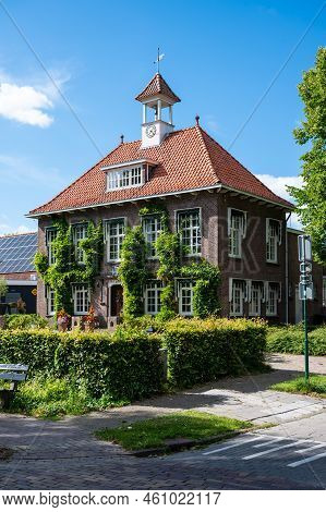 Peize, Groningen, The Netherlands - 07 20 2022 - Traditional Country Style Building Decorated With F