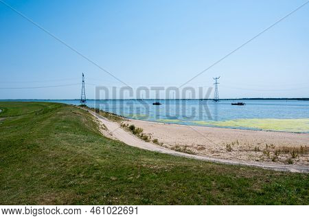 Green Polder, Sand Beach And Ketel Lake In Flevoland, The Netherlands