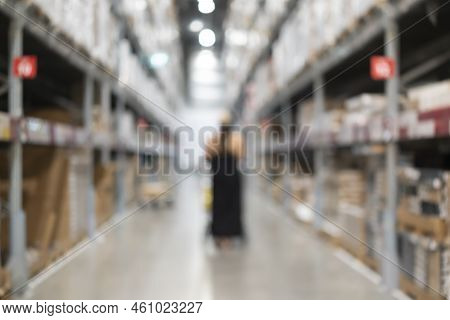 Blurred Bix Box Store Supercenter With Customers Shopping For Home Goods. Blurred Of Busy Shoppers W