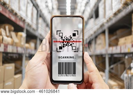 Online Shopping Concepts With Youngman Using Smartphone With Qr Code On Product Package Box. E Comme