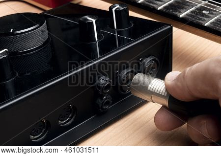 Man Plug An Xlr Cable To A Computer Sound Card