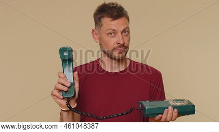 Hey You, Call Me Back. Handsome Young Man In Red T-shirt Talking On Wired Vintage Telephone Of 80s, 