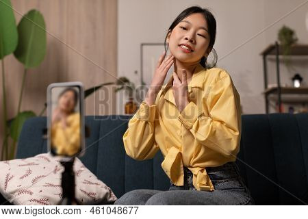 Asian Beauty Blogger Woman Making Facial Massage Creating Video Indoor