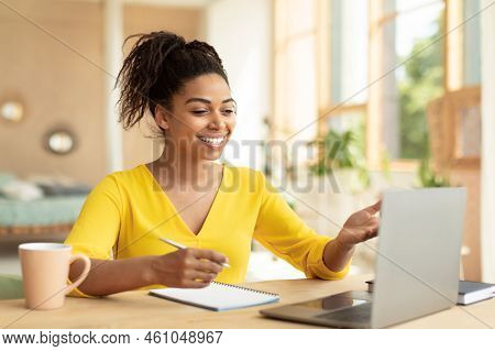 E-learning Concept. Happy Black Female Teacher Having Video Chat With Students, Talking At Laptop We