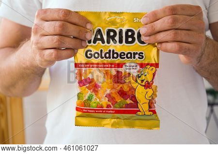 Pskov, Rusia - August 09, 2022: A Man Keeps Up To Date With A Pack Of Haribo Chewing Beers.