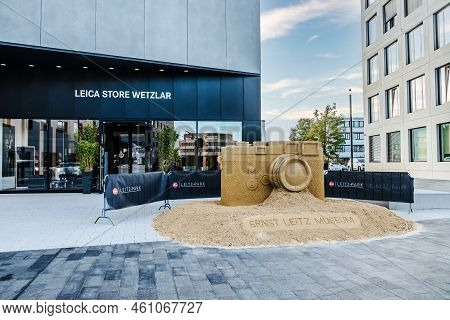 Wetzlar, Germany - 2021-10-01:  Leica Store In Wetzlar With Artwork, Leica Camera Modeled From Sand.