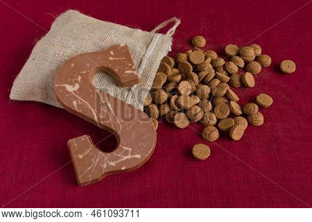 Dutch Sinterklaas Tradition: A Chocolate Letter And A Bag With Candy Called Pepernoten.