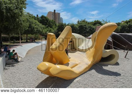 Valencia, Spain - 15 May 2014: Hand Of Large-scale Fallen Gulliver Where Kids Play. Children's Playg