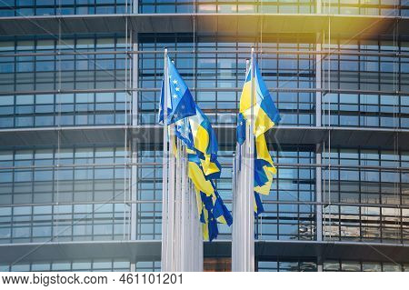 Strasbourg, France - Mar 8, 2022: The Ukrainian Flag Flies Next To The Flag Of Europe And All Eu Uni
