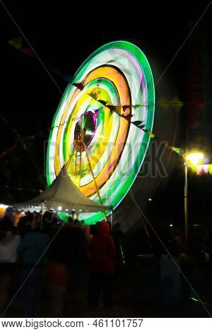 Ferris Wheel At Night Festival In Slow Motion Photo. High Roller