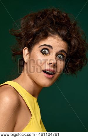 Frightened Curly Woman With Creative Make-up In Yellow Dress