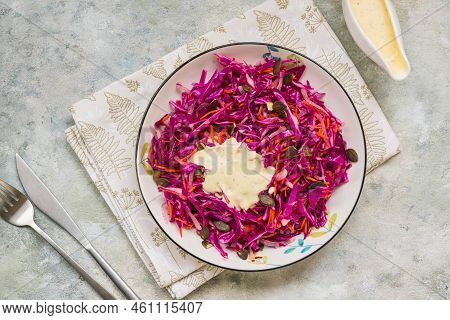 Coleslaw Salad Of Red Cabbage And Carrots With Mayonnaise Dressing In A White Bowl On A Gray Concret