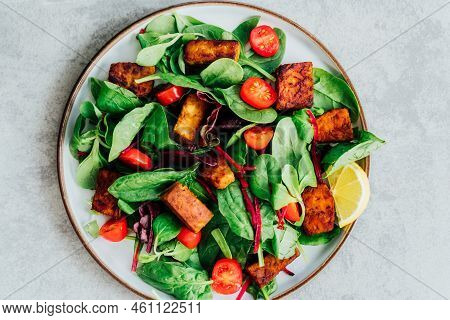 Top View Healthy Salad With Roasted Tempeh, Cherry Tomato, Beetroot Straws, Spinash And Lettuce Leav