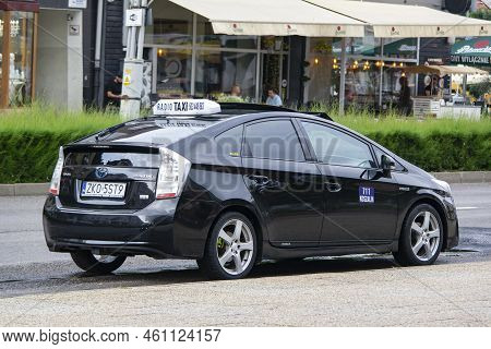 Koszalin, Poland - August 5, 2022: Toyota Prius Hybrid Taxi Car In Streets Of Koszalin, Poland