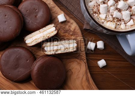 Tasty Choco Pies And Cocoa With Marshmallows On Wooden Table, Flat Lay