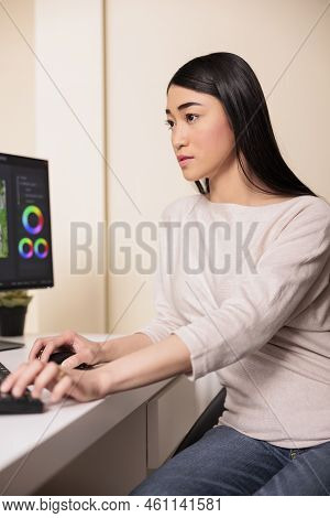 Female Videographer Using Montage To Edit Film In Multimedia Software For Post Production. Editing M