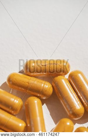 Turmeric Plus Black Pepper Extract Gelatin Capsule Close Up Top View. Herbal Supplement Organic Curc