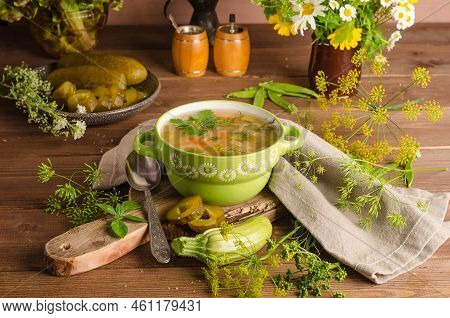Traditional Rassolnik Soup With Pickled Pickles In A Green Tureen On A Wooden Background