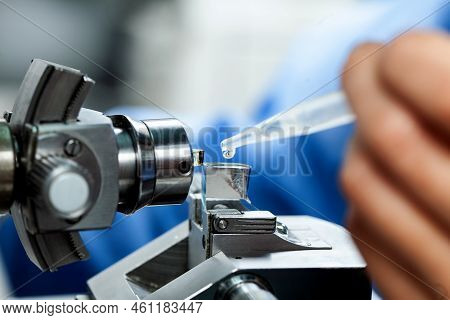 Closeup A Scientist Adding Water To Glass Knife With Waterboat Mounted On An Ultramicrotome To Make 
