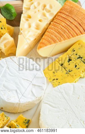Camember And Maasdam, Smoked Cheese, Blue Cheese, Parmesan, Brie Cheese With Basil And Pepper On Whi