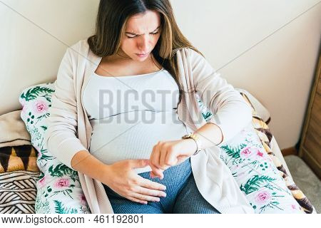 Pregnant Contractions Time. Pregnancy Woman Watching Clock, Holding Baby Belly. Childbirth Time, Con