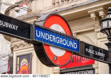 London, Uk - August 22, 2022: Low Angle View Of Underground Sign In Picadilly Circus Against Sky A S