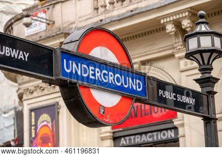 London, Uk - August 22, 2022: Low Angle View Of Underground Sign In Picadilly Circus Against Sky A S